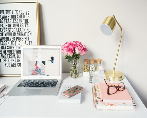 Organized desk space showing a notebook and natural light