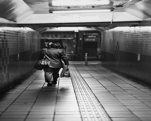 Commuter walking comfortably to a TransMilenio station